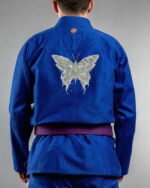 Skull Butterfly embroidery on the back of a blue BJJ Gi