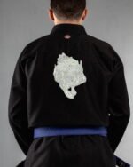 Skull Holding Skull embroidery on the back of a black BJJ Gi