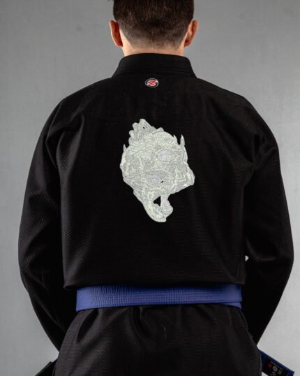 Skull Holding Skull embroidery on the back of a black BJJ Gi