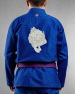 Skull Holding Skull embroidery on the back of a blue BJJ Gi