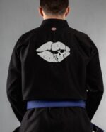 Skull Lips embroidery on the back of a black BJJ Gi