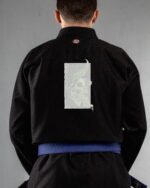 Skull With A Broken Horn embroidery on the back of a black BJJ Gi