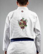 Skulls & Roses embroidery on the back of a white BJJ Gi