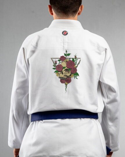 Skulls & Roses embroidery on the back of a white BJJ Gi