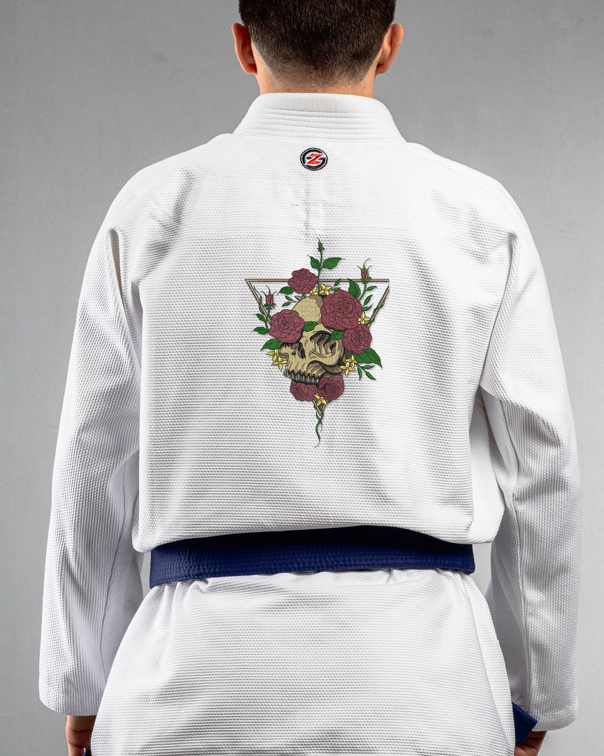 Skulls & Roses white Gi back mockup Skulls & Roses embroidery on the back of a white BJJ Gi