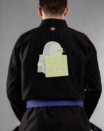 Steal Bitches embroidery on the back of a black BJJ Gi