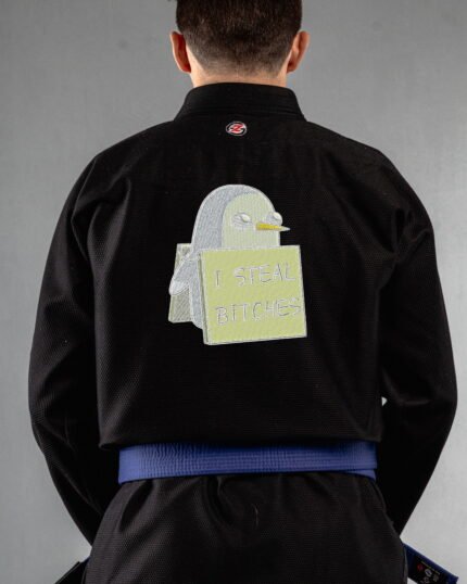 Steal Bitches embroidery on the back of a black BJJ Gi