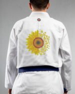 Sunflower embroidery on the back of a white BJJ Gi