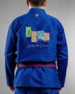Long Story Short I Survived embroidery on the back of a blue BJJ Gi