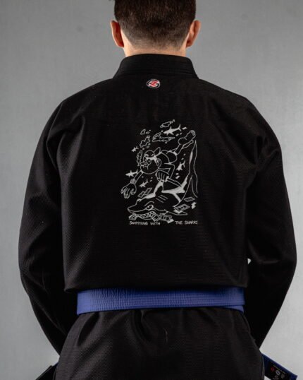 Swimming With The Sharks embroidery on the back of a black BJJ Gi
