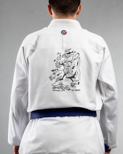 Swimming With The Sharks embroidery on the back of a white BJJ Gi