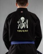 Trying My Best embroidery on the back of a black BJJ Gi