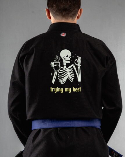 Trying My Best embroidery on the back of a black BJJ Gi