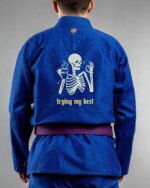 Trying My Best embroidery on the back of a blue BJJ Gi