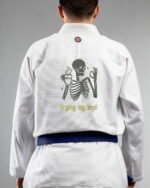 Trying My Best embroidery on the back of a white BJJ Gi