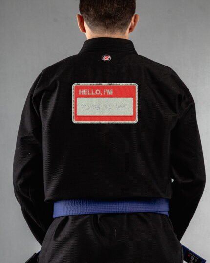 Trying My Best embroidery on the back of a black BJJ Gi