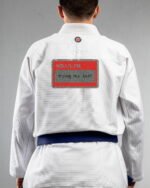 Trying My Best embroidery on the back of a white BJJ Gi