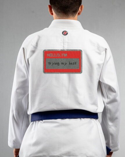 Trying My Best embroidery on the back of a white BJJ Gi