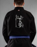 Uninvited Reach ,door embroidery on the back of a black BJJ Gi
